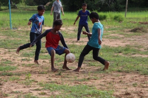 Some of the students playing football after class